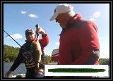 Dan checks out the weight of this 2 1/2 lb Largemouth Bass AL caught