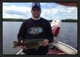 Vinny get his turn at bringing in a nice Smallmouth Bass! He caught this one in 4ft depth of open water in Back Bay.